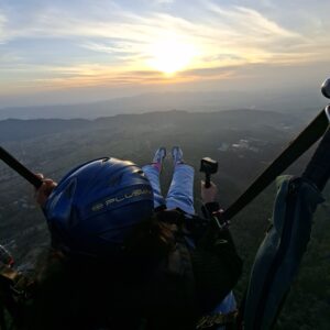 Paraglider Flying Over Bir Billing Valley At Sunset With Himalayan Mountain Views