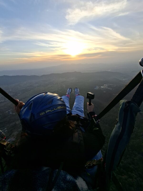 Paraglider Flying Over Bir Billing Valley At Sunset With Himalayan Mountain Views
